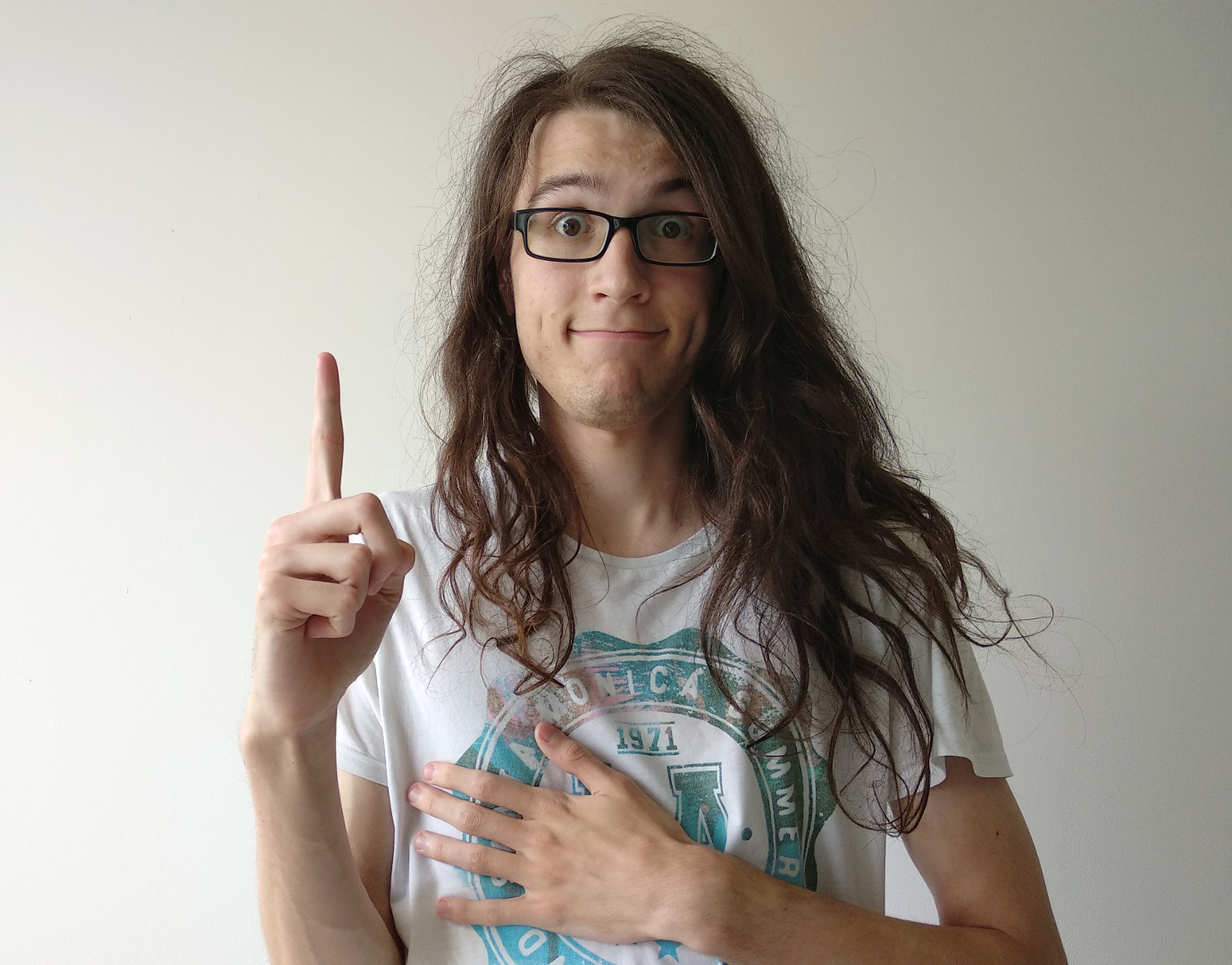 Image of myself standing, looking like a goofball with lots of long hair being all over the place